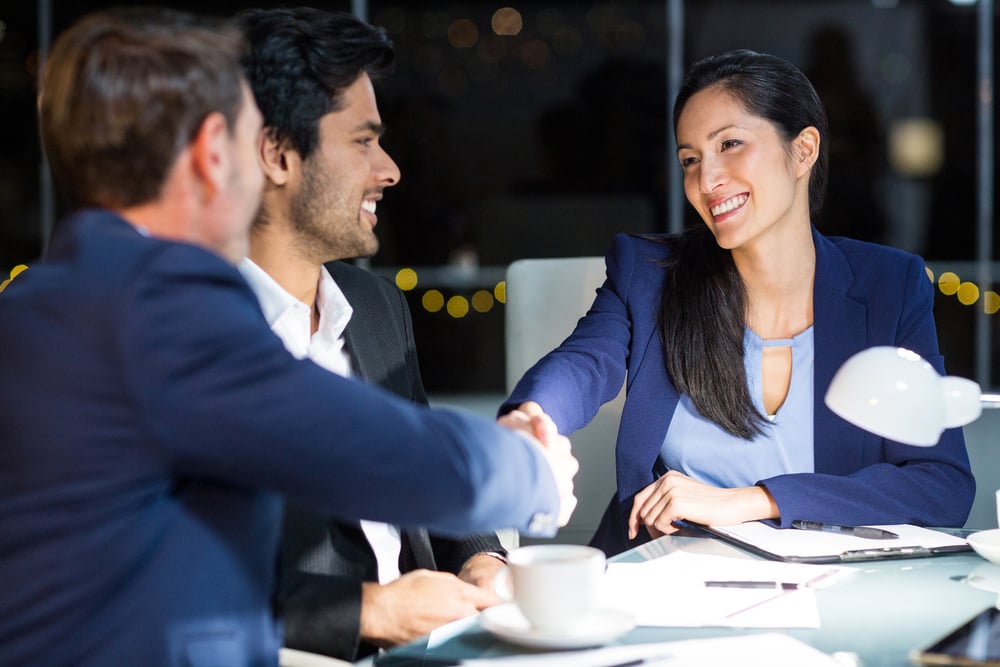 Businessman shaking hands with a colleague in the office-1